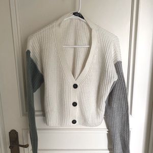 White colour-blocked cardigan, green and grey sleeve. Good condition